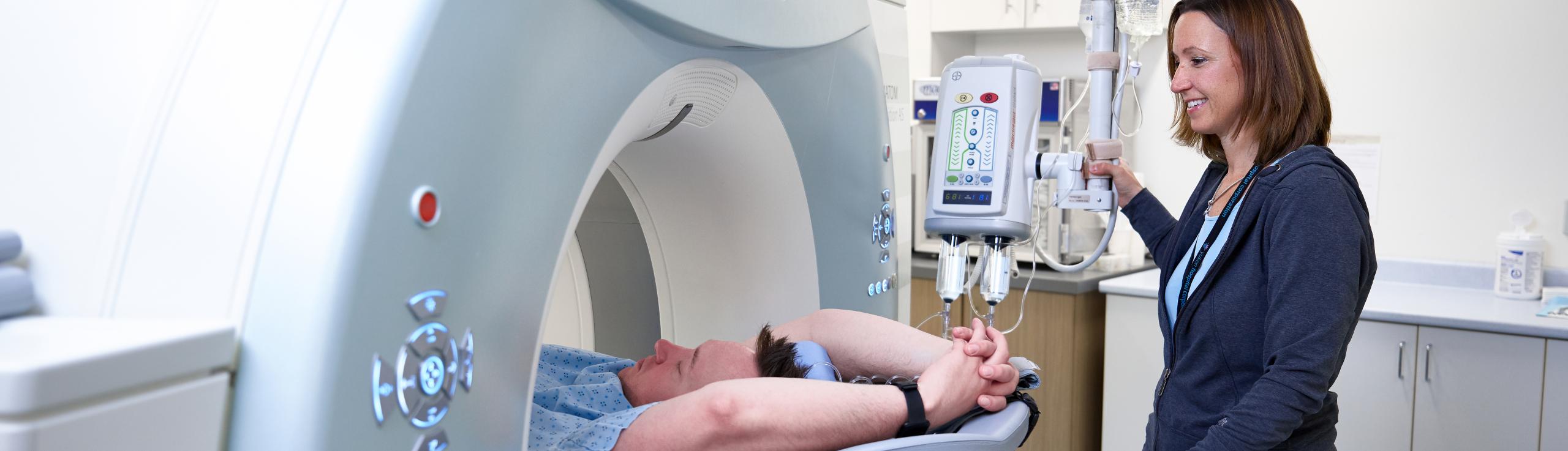 A Medical Imaging team member performs a CT exam on a patient at Whitehorse General Hospital. 